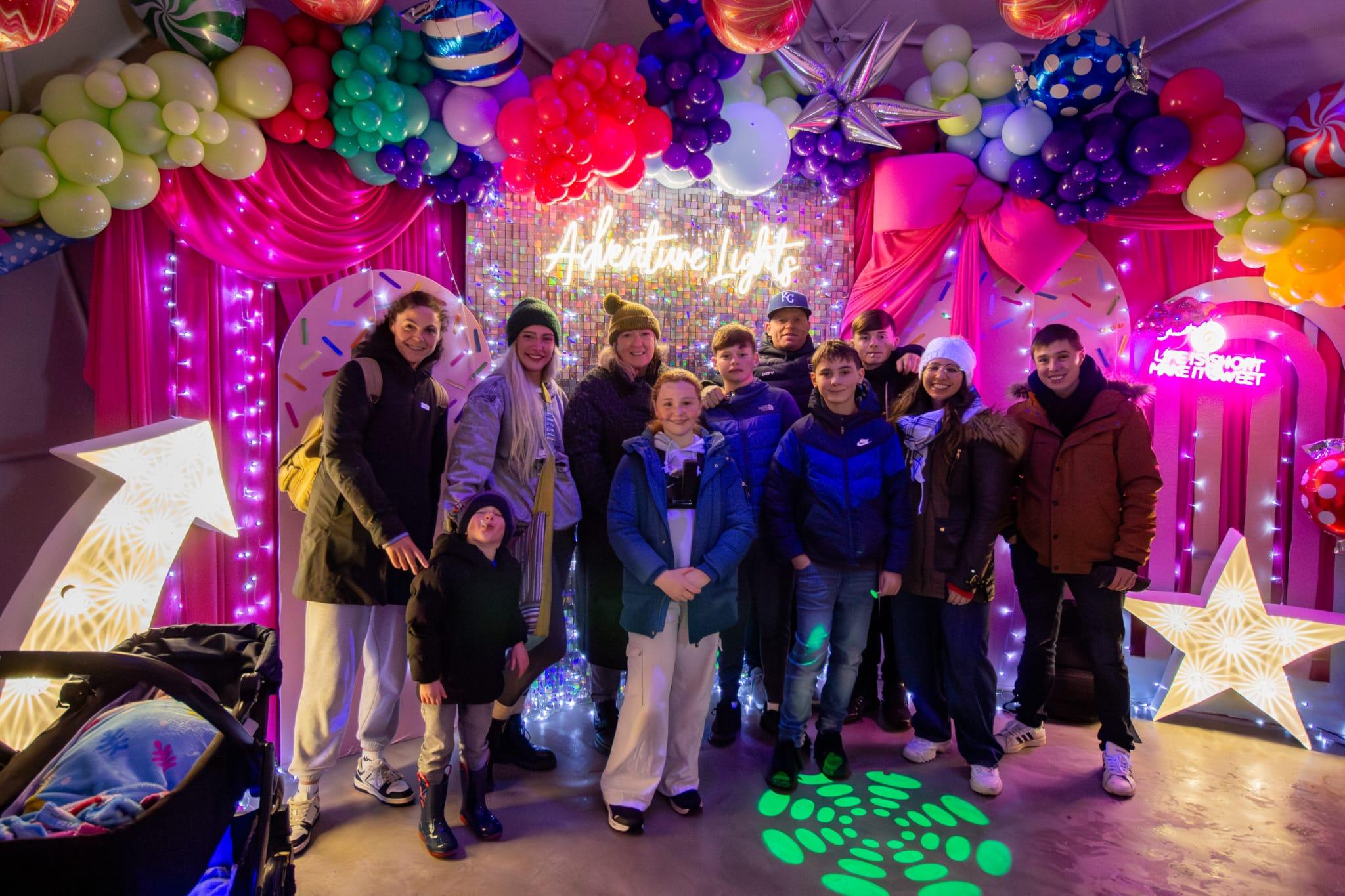 Family enjoying the illuminated Adventure Lights trail at Skypark Carlingford